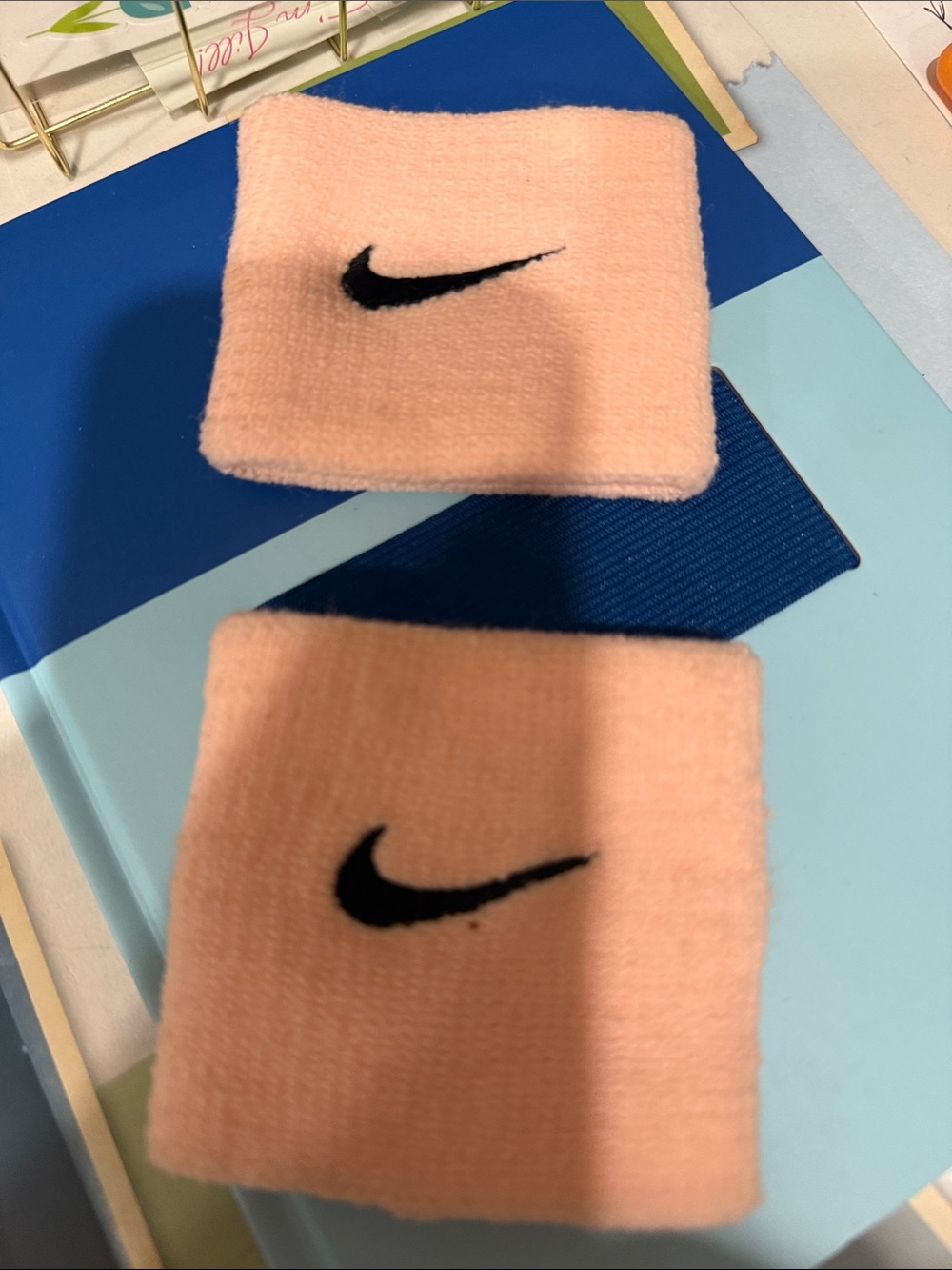 Nike GIRLS Peach Sweat Wristbands with Black Swoosh
